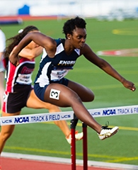Monroe hurdling at the NCAA 2014 Outdoor Championships